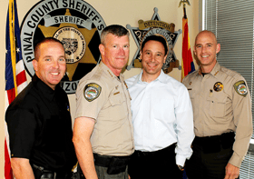 four police officers smiling